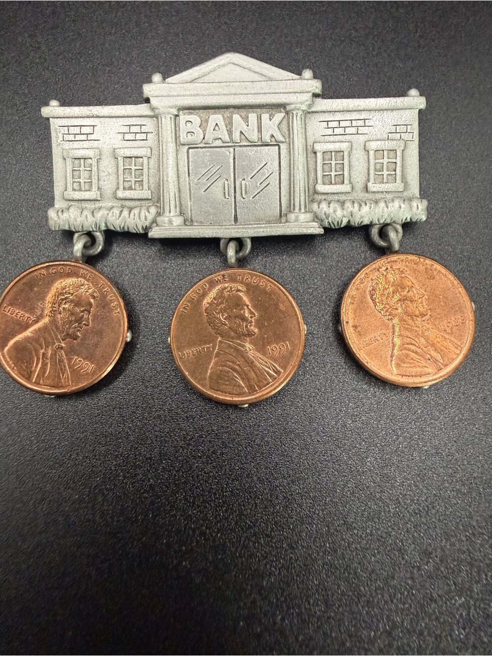 vintage pewter "Bank" brooch pin featuring three dangling 1991 US pennies
